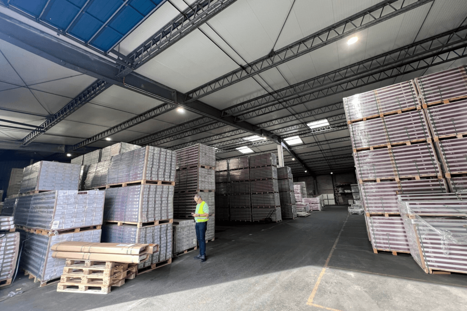 Pallets of engineered hardwood flooring stocked in a Floors4Ever distribution centre